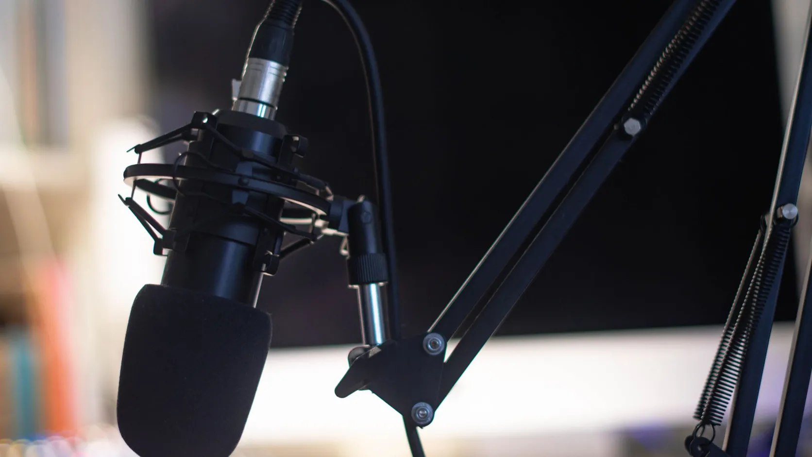 Studio condenser microphone on a dark background