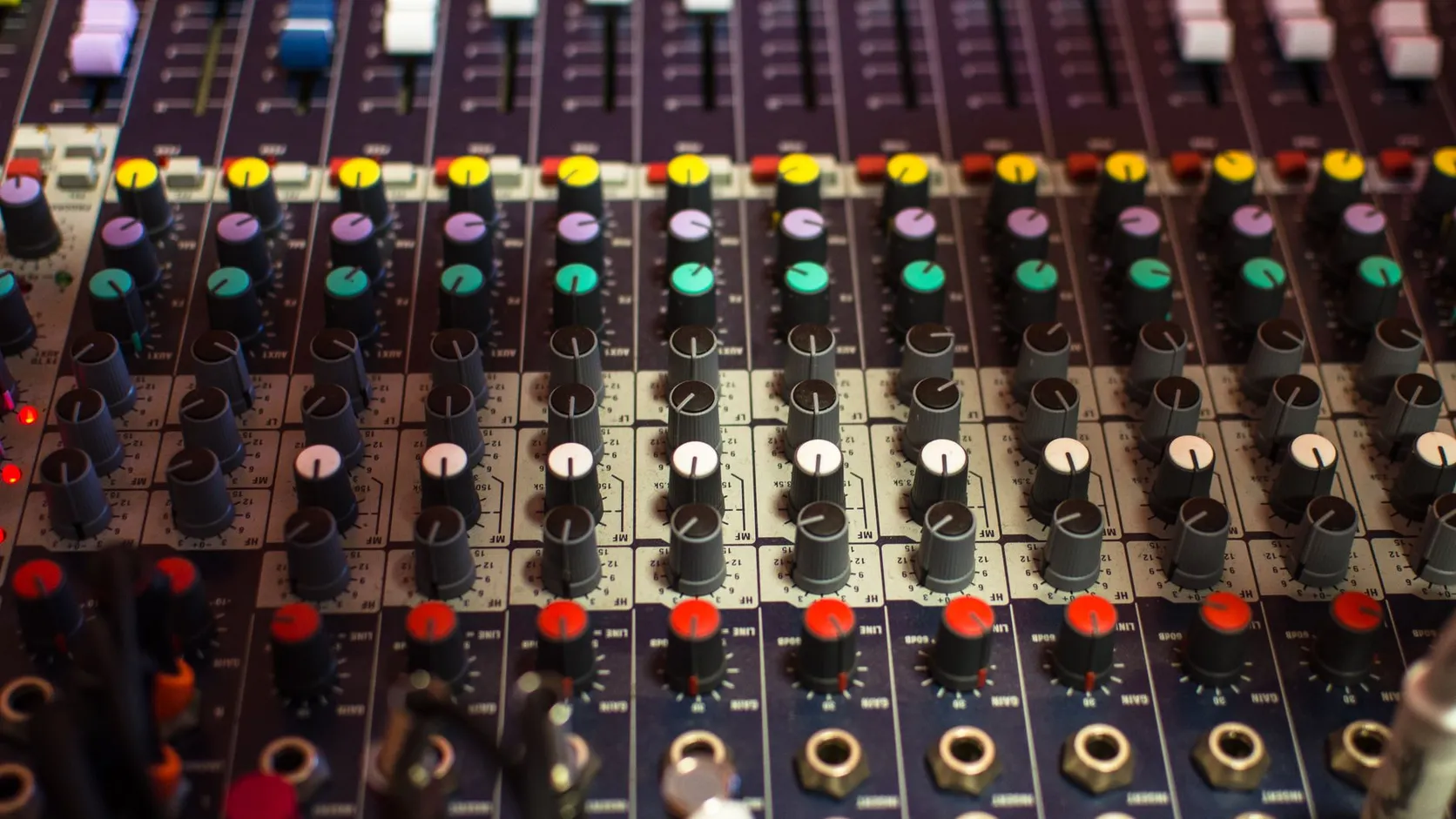 Close-up of mixing console knobs and controls